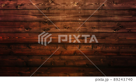 木目や節のある焦げ茶色の板が水平に打ち付けられた横長の背景画像 89243740