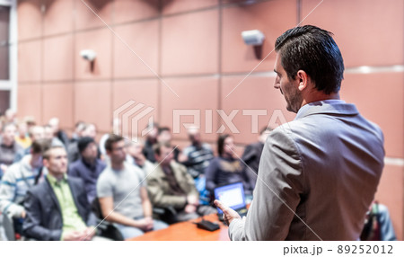 Public speaker giving talk at business event. 89252012