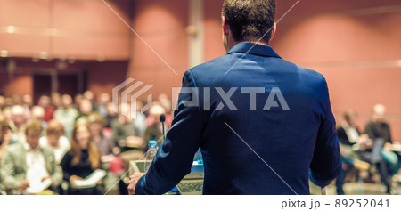 Public speaker giving talk at Business Event. 89252041