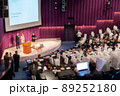 Defocused image of speakers giving a talk at business meeting 89252180
