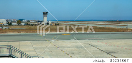 Control tower and runway in airport. Control tower and runway in airport. 89252367