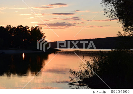 Beautiful lake in sunset lights. Scenic nature landscape. 89254606