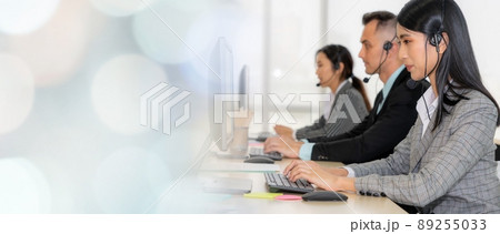 Business people wearing headset working in office broaden view 89255033