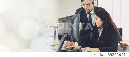 Business people wearing headset working in office broaden view 89255061