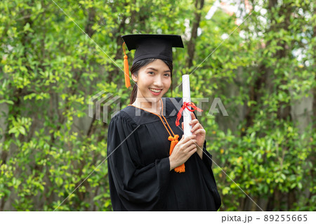 Attractive Asian Women Student Graduate in cap and gown celebrating with certificate in hand and so proud happiness in Commencement day,Congratulation of student in graduation day,Education Success Attractive Asian Women Student Graduate in cap and gown celebrating with certificate in hand and so proud happiness in Commencement day,Congratulation of student in graduation day,Education Success 89255665