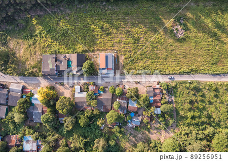 Aerial view of small town or local village among agricultural plantation in countryside 89256951