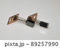Carbon brush for electrical micromotor on white background. Macro image. 89257990
