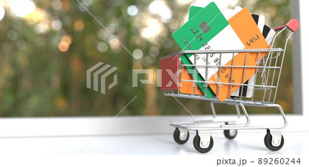 Credit card mockups with flags of Ireland in a small shopping cart. 3D rendering 89260244