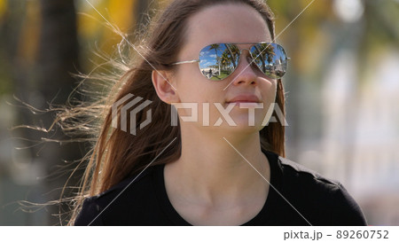 Young pretty woman enjoys the sun of Miami Beach 89260752