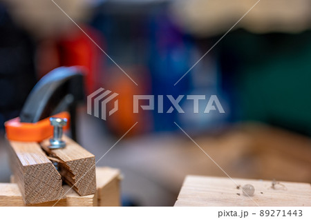 Selective focus on cracked and split wood from not drilling a pilot hole before driving a screw Selective focus on cracked and split wood from not drilling a pilot hole before driving a screw 89271443
