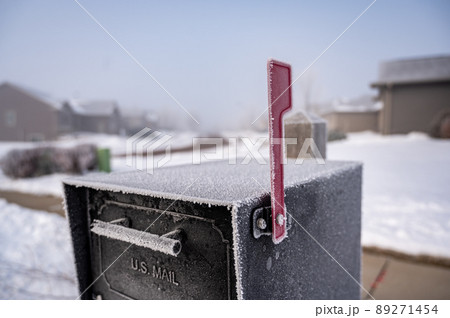 Morning frost covering a mailbox in an early morning winter 89271454