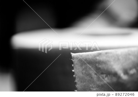 selective focus on the edge sheet of a roll of toilet paper where individual threads are visible. selective focus on the edge sheet of a roll of toilet paper where individual threads are visible. 89272046