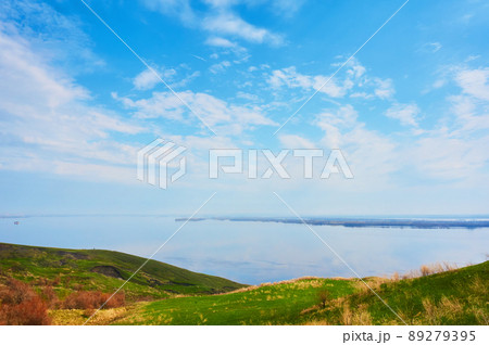 Mountain sea shore in the fall against the blue sky with clouds. 89279395