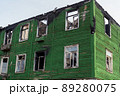 The old wooden burned-down house front view 89280075