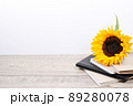 Back to school desk background with stack of sketchbooks or notebooks 89280078