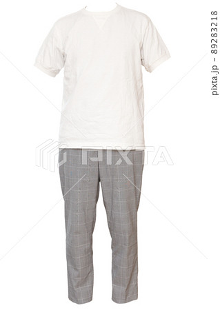 Coordination of Glen Check slacks and white... - Stock Photo