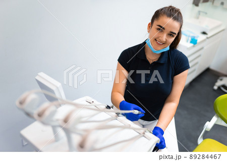 Young female dentist with drill in his hands 89284467