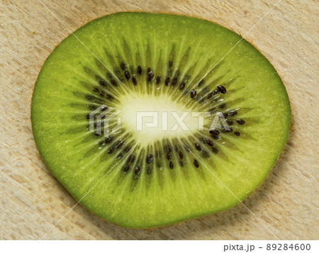 Slice of Kiwi fruit over wood background 89284600