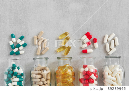 Several bottles of supplements pills. Variety of nutritional supplements and vitamin capsules. Top view. 89289946