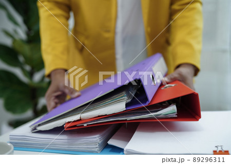 Businessman working and prepare paperwork report data to analysis information in file binder at office. Businessman working and prepare paperwork report data to analysis information in file binder at office. 89296311