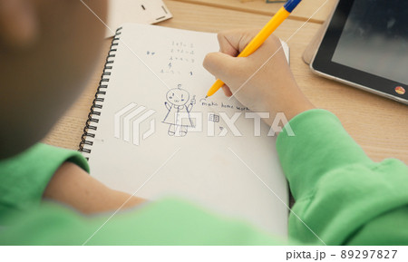 Student in international preschool writing a book together in Elementary School Class, Pupils enjoying studying in classroom. 89297827