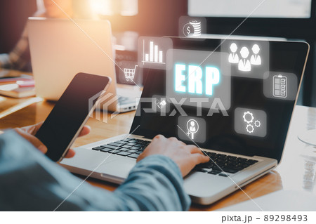 Enterprise Resource Planning ERP, document management concept with icons on virtual screen, Business woman working with laptop computer with icons on virtual screen on office desk. Enterprise Resource Planning ERP, document management concept with icons on virtual screen, Business woman working with laptop computer with icons on virtual screen on office desk. 89298493