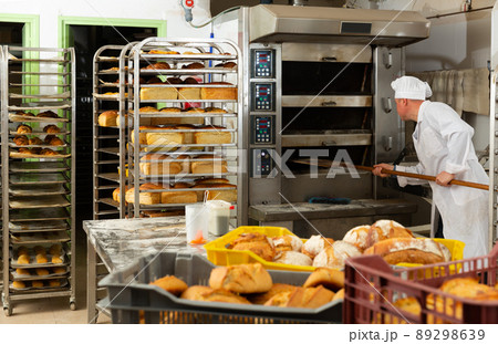 Usual work of baker in a bakery Usual work of baker in a bakery 89298639