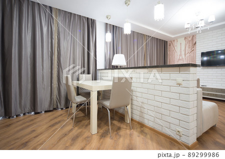 Stylish kitchen interior with dining table and chairs 89299986