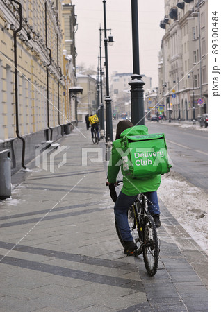 food delivery man on a bicycle in moscow 89300484