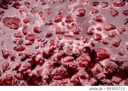 Strawberry jam is boiling, detailed shooting. 89302711