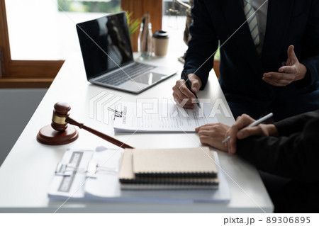 Businessman and lawyer discuss the contract document. Treaty of the law. Sign a contract business. 89306895