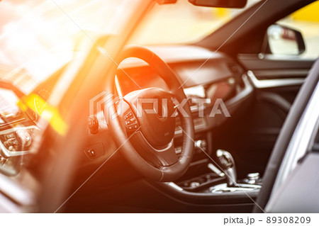 multimedia control panel on the steering wheel of a modern car multimedia control panel on the steering wheel of a modern car 89308209