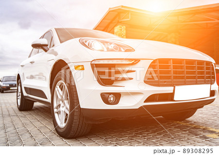 Compact white executive car, business car, large chrome grille. Compact white executive car, business car, large chrome grille. 89308295