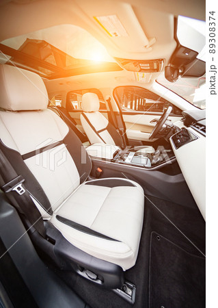 Modern luxury prestige car interior, dashboard, steering wheel. Orange red car interior. 89308374