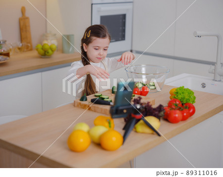 Young Girl Vlogger Making Social Media Video About Cooking For Internet At Home 89311016