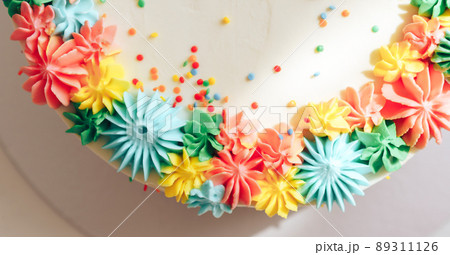 Easter cake decorated with multi-colored cream 89311126