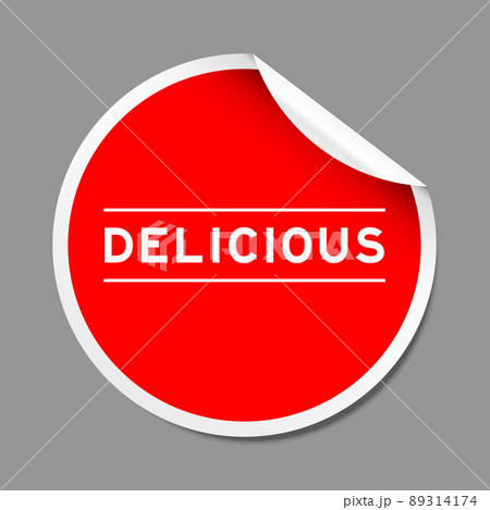 Red color peel sticker label with word delicious on gray background 89314174