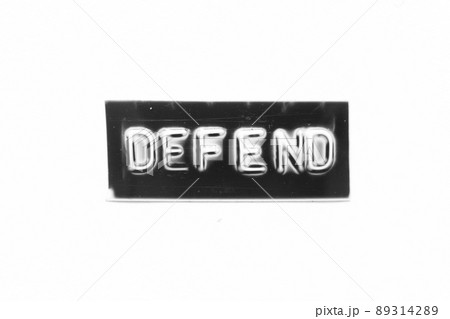 Black color banner that have embossed letter with word defend on white paper background Black color banner that have embossed letter with word defend on white paper background 89314289