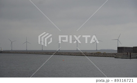 The theme is net power generation and environmental protection. A number of wind blades, wind power in the Baltic Sea in Europe Denmark Copenhagen in winter 89316721