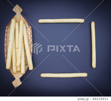 Breadsticks on dark background Breadsticks on dark background 89319931