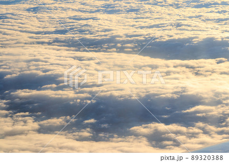 Beautiful white clouds in blue sky. View from airplane 89320388