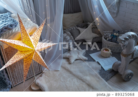 Childen's room corner with a beautifully decorated play tipi tent. Wigwam 89325068