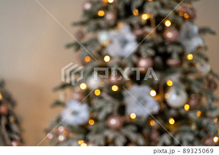 Decorated Christmas tree on blurred, sparkling and fairy background 89325069