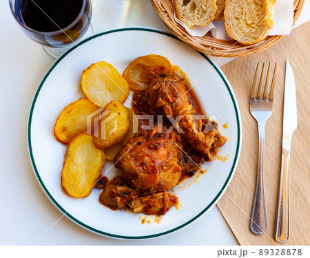 Tasty baked chicken and potatoes 89328878