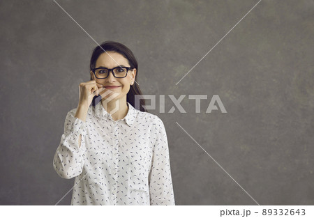 Young caucasian woman closing zip on lips showing keeping secrete gesture 89332643