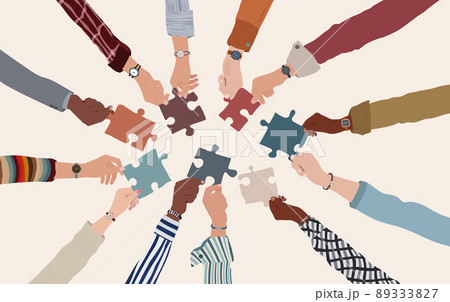 Group of multicultural business people with arms and hands in a circle holding a piece of jigsaw. Co-workers of diverse ethnic groups and cultures. Cooperate - collaborate. Teamwork Group of multicultural business people with arms and hands in a circle holding a piece of jigsaw. Co-workers of diverse ethnic groups and cultures. Cooperate - collaborate. Teamwork 89333827