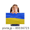 Girl holding Ukrainian blue and yellow flag 89336723