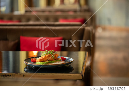 Grilled salmon steak with zucchini 89338705