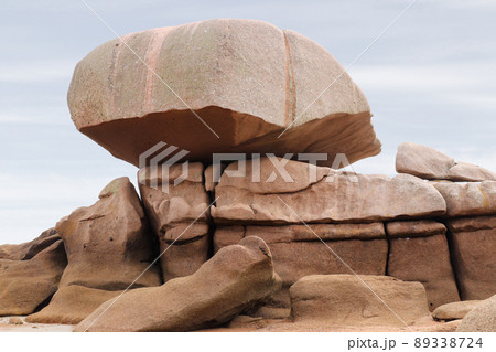 Bizarre boulders and rocks on the Pink Granite Coast on the island of Renote in Brittany Bizarre boulders and rocks on the Pink Granite Coast on the island of Renote in Brittany 89338724