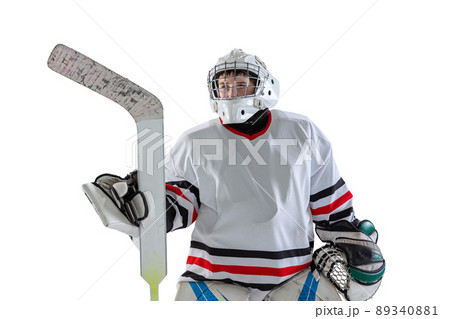Half-length portrait of boy, child, hockey player in uniform of goalkeeper posing isolated over white studio backgrund Half-length portrait of boy, child, hockey player in uniform of goalkeeper posing isolated over white studio backgrund 89340881